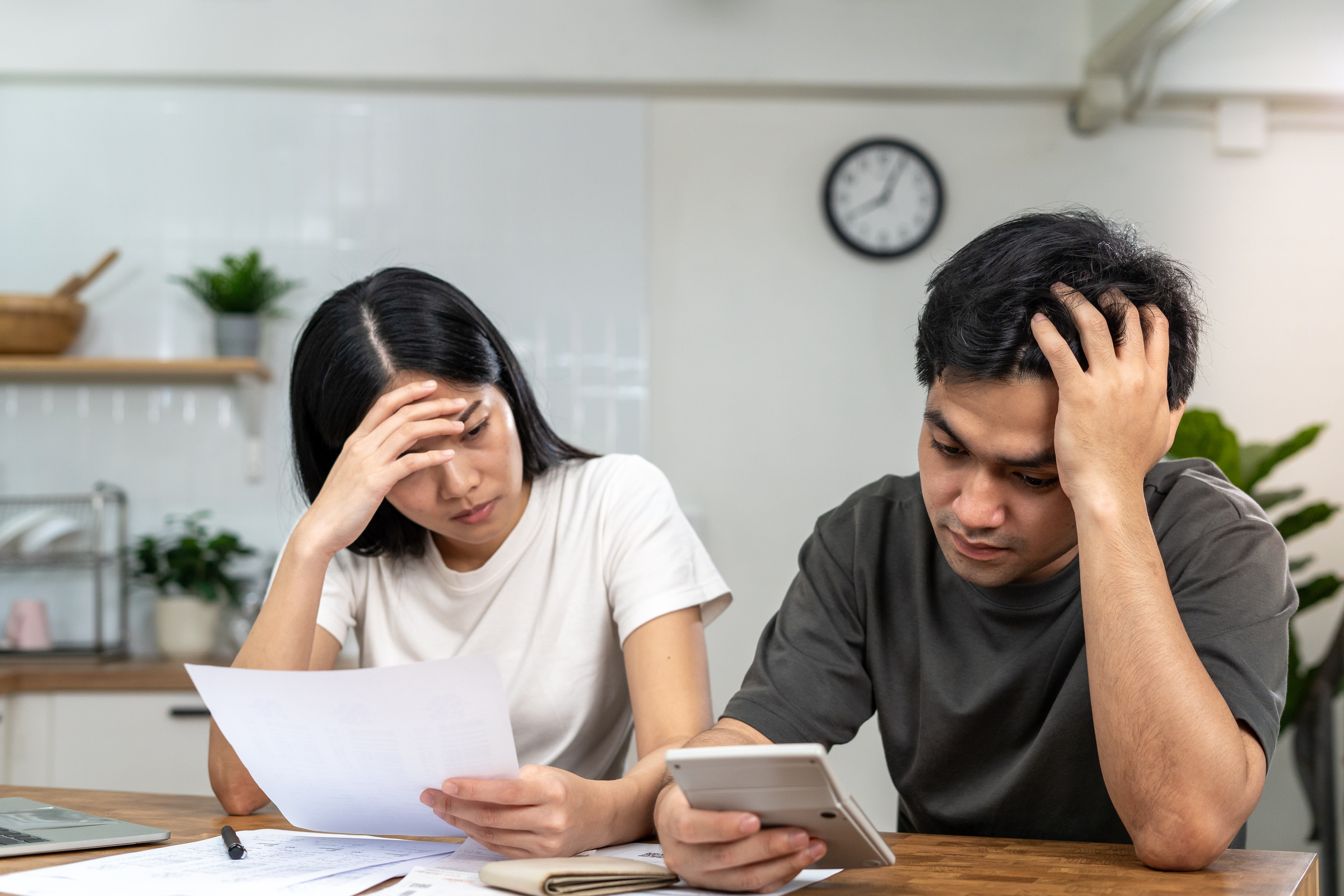 Asian couples are worried about debt and expenses. Stressful